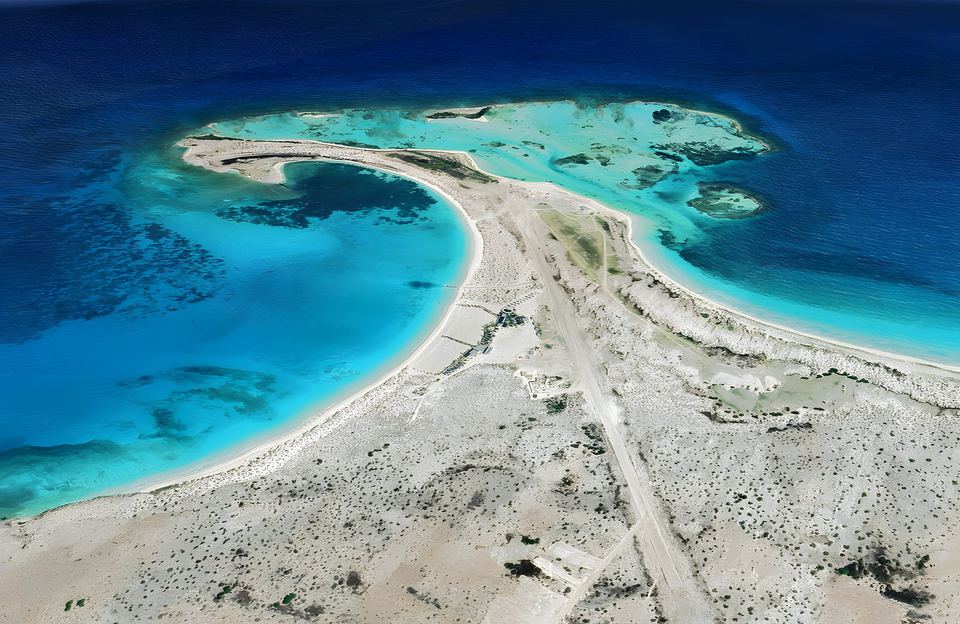 Aerial view of the Punta Delgada bay and the airstrip at the east end of La Tortuga