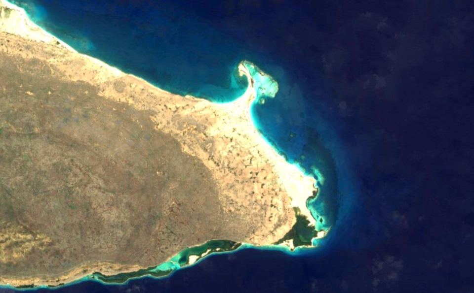 Satellite image of the eastern end of La Tortuga, with Punta Delgada and its lagoons and reefs